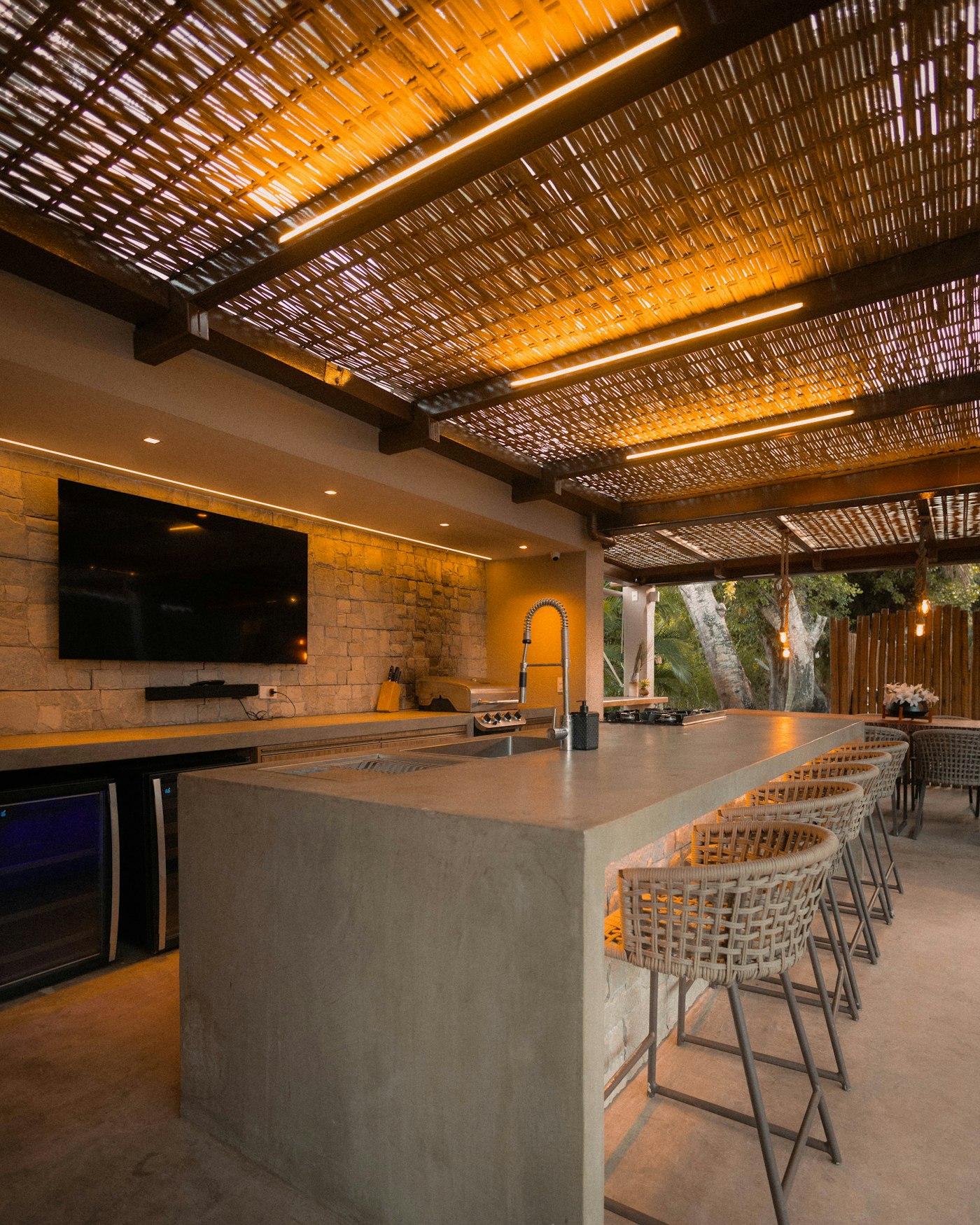 Modern outdoor kitchen with bar seating