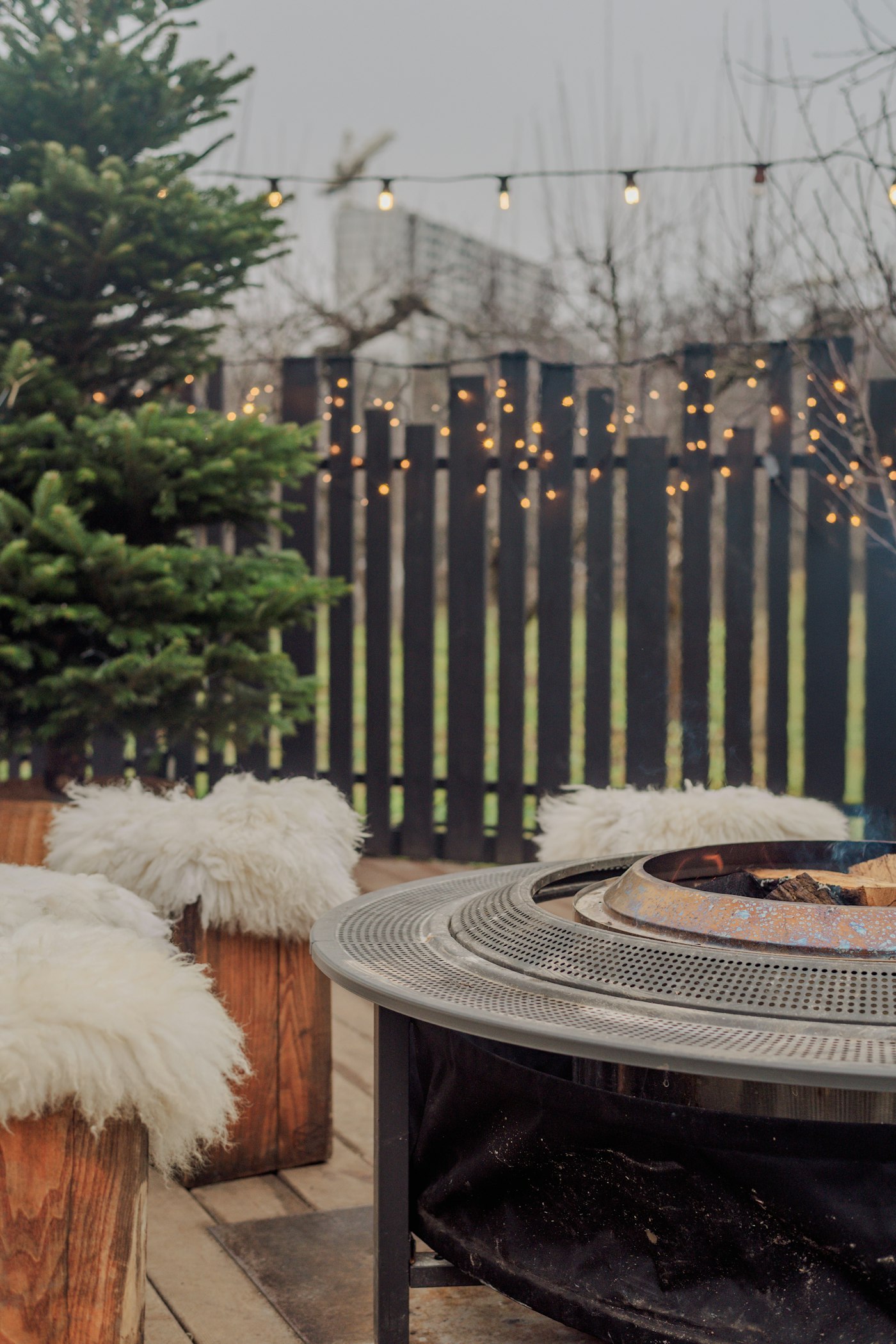 Backyard patio with fire pit and cozy outdoor seating