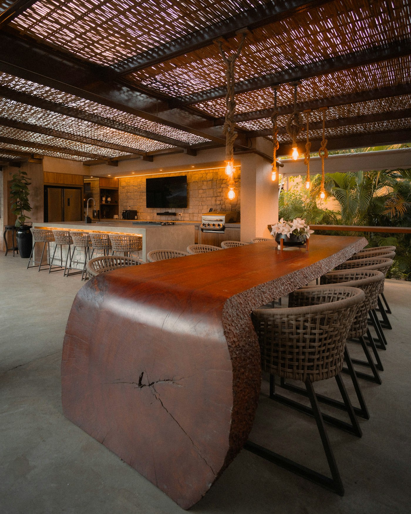 Outdoor dining table with large slab top and chairs